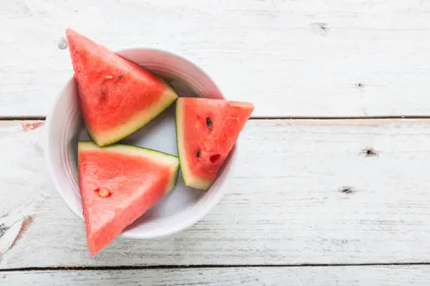 Photo of Watermelon on wooden table background