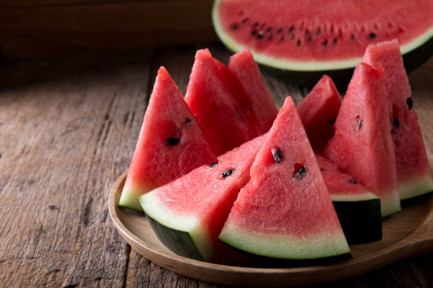 istock Watermelon on wooden table background 1045696394