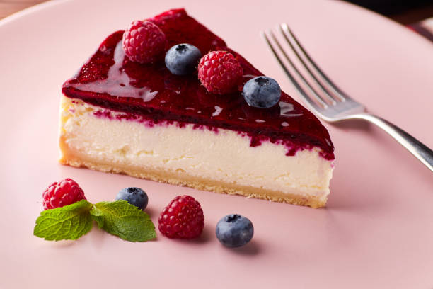 istock Cheesecake with berries on wooden background 1045696660