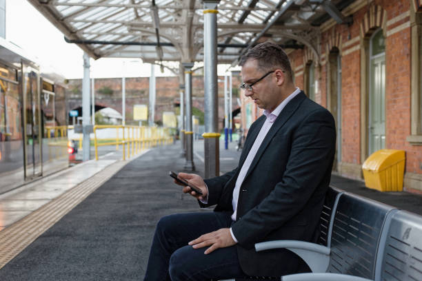 istock man seating in rail station 1045699950