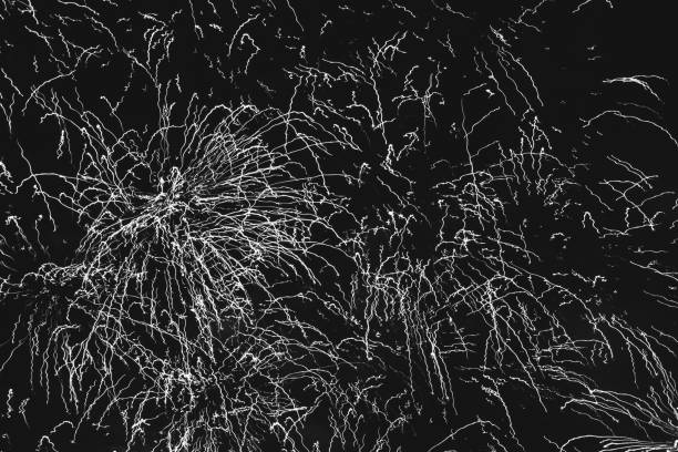 istock abstract background festive fireworks on the night black sky, black white photo 1045702548