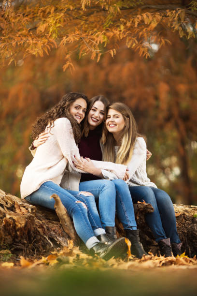 istock Three best friends hugging outdoors in the autmn 1045705124