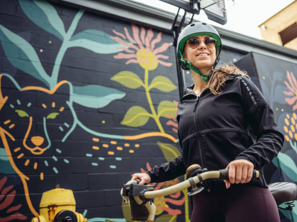istock Young woman on cruiser bicycle 1045705362