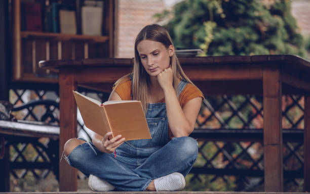 istock Woman student reading for exam 1045705364