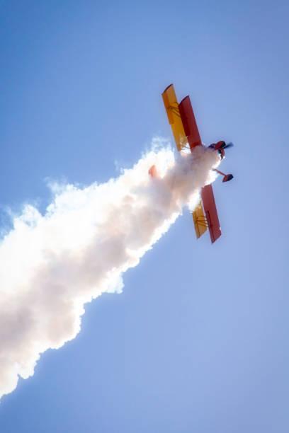 airplane performing in an air show - stunt airplane air air vehicle imagens e fotografias de stock