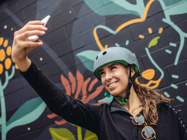 istock Young woman biking selfie 1045707720