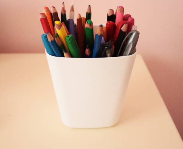 istock white pen holder and pencils inside 1045716958