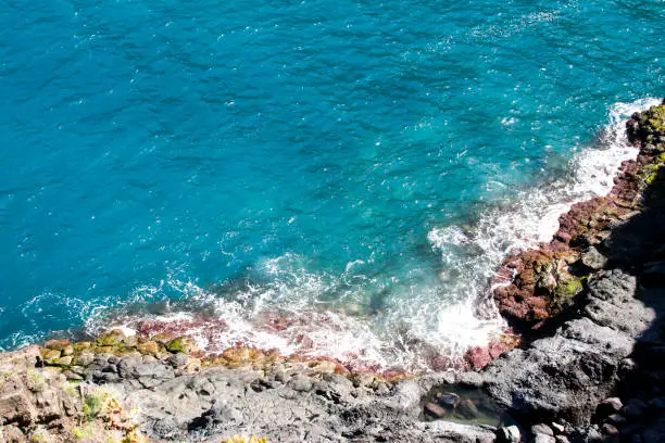 Regarding the Atlantic from a cliff on the island of Tenerife, in the Canary Islands.