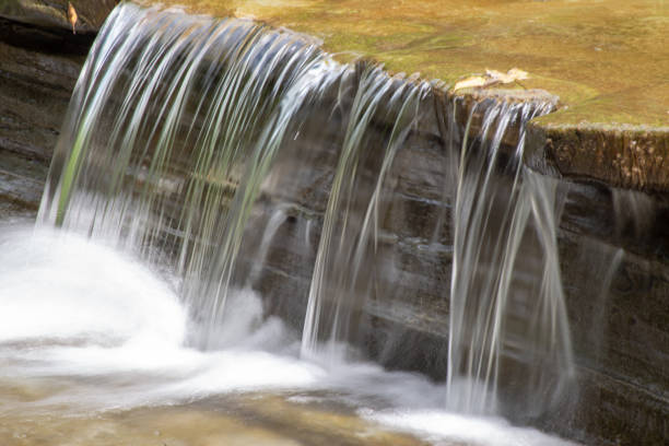 Waterfall on Four mile creek during a warm late summer day at Wintergreen Gorge in Northwestern Pennsylvania near city of Erie.