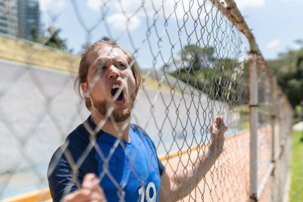 istock French fan watching a soccer game 1045724810