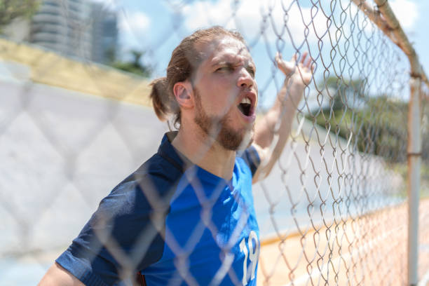 istock French fan watching a soccer game 1045727474
