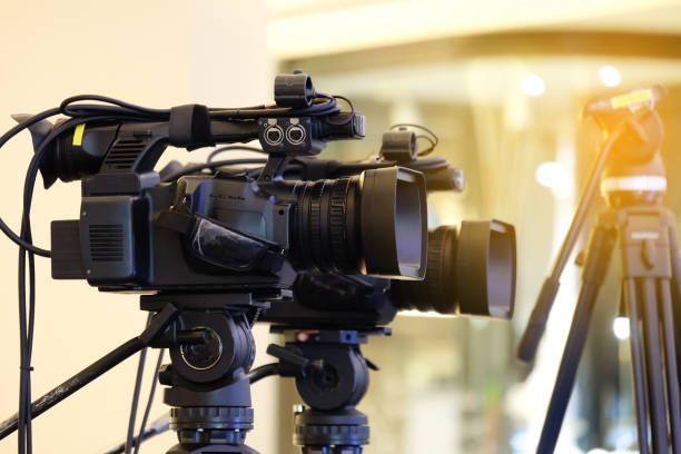 istock Photographer video recording activity within the event 1045728006