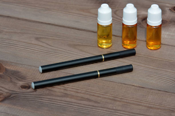 istock E - cigarette for vaping , technical devices.The liquid in the bottle 1045737836
