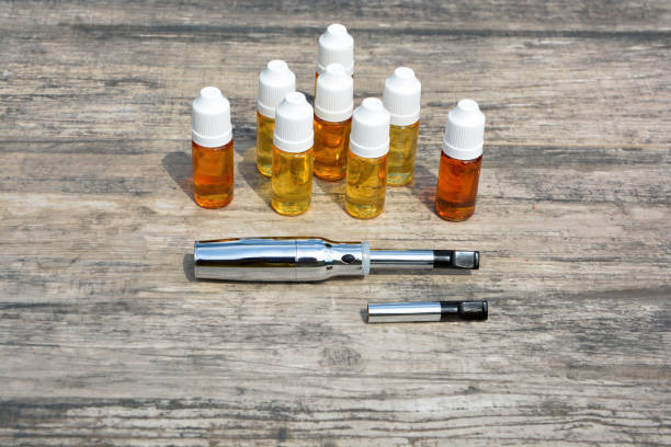istock E - cigarette for vaping , technical devices.The liquid in the bottle 1045737840