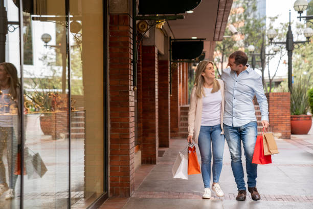 istock Happy couple shopping at the mall 1045761026