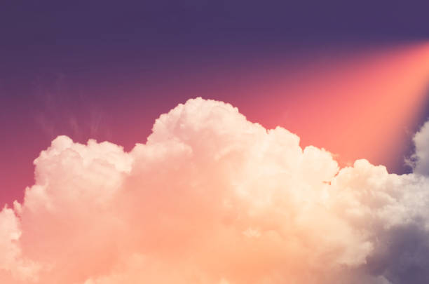 istock Nature background. Fluffy soft clouds in sky toned. 1045770964