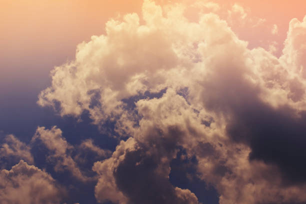 istock Nature background. Fluffy soft clouds in sky toned. 1045771088
