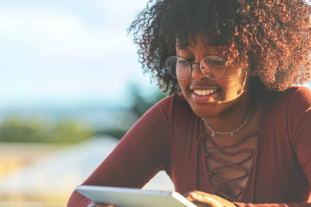 istock Outdoors with Technology Late Day Young Ethiopian Female Student 1045776064