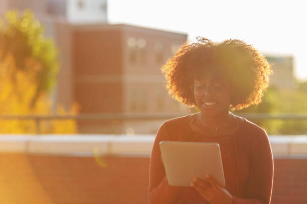 istock Outdoors with Technology Late Day Young Ethiopian Female Student 1045778388