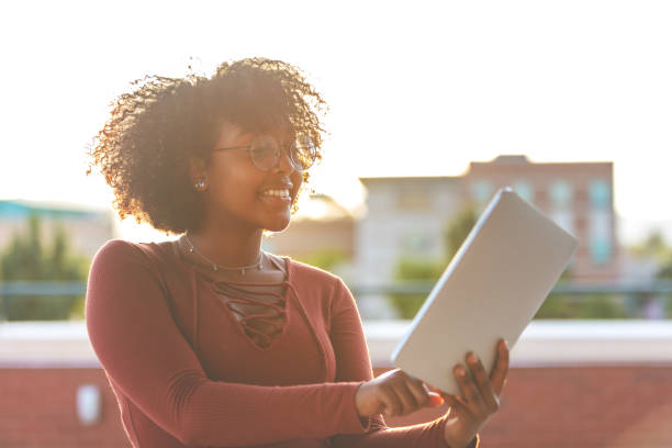istock Outdoors with Technology Late Day Young Ethiopian Female Student 1045778540