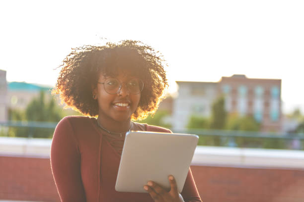 istock Outdoors with Technology Late Day Young Ethiopian Female Student 1045778584
