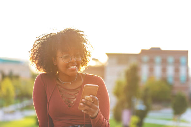 istock Outdoors with Technology Late Day Young Ethiopian Female Student 1045778588