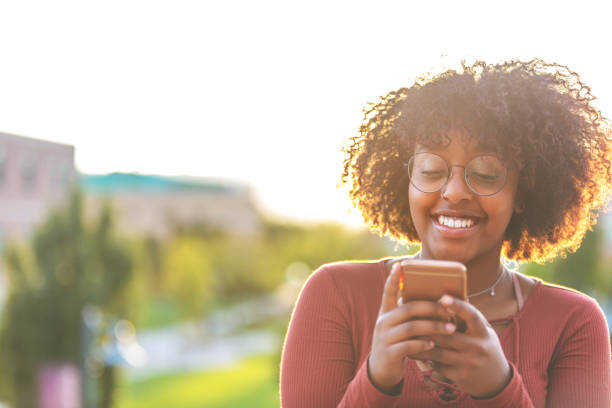 istock Outdoors with Technology Late Day Young Ethiopian Female Student 1045778610
