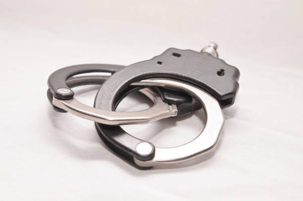 istock A set of black and white handcuffs 1045796084
