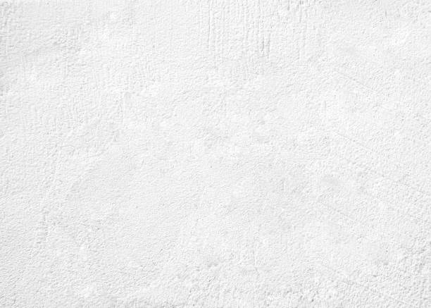 istock White pastel rough crack cement texture stone concrete,rock plastered stucco wall; painted flat fade background gray solid floor grain. 1045798956