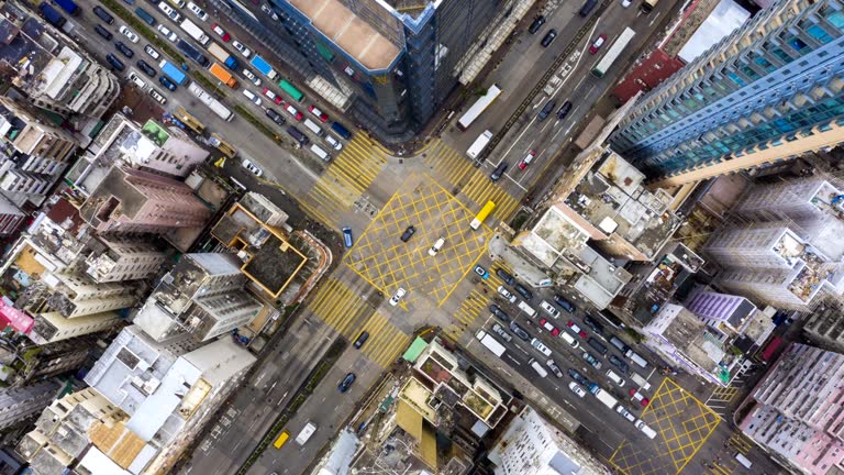 4k Zoom out hyperlapse of Urban Crossing road direct above in Day, Hong Kong