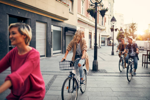 istock Friends Riding Rented Bicycles In A City 1045815524