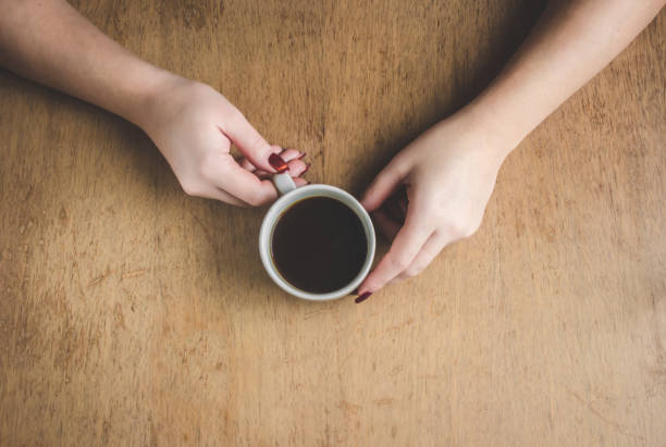 istock Cup of coffee for Breakfast in his hands. Selective focus. 1045832824