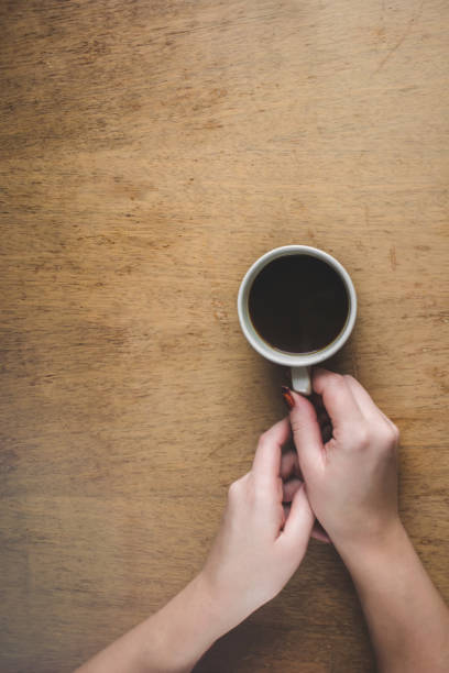 istock Cup of coffee for Breakfast in his hands. Selective focus. 1045832864
