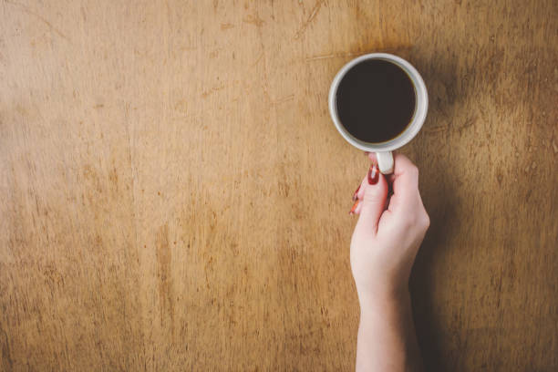 istock Cup of coffee for Breakfast in his hands. Selective focus. 1045833018