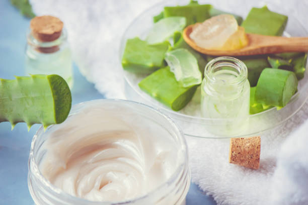 istock Aloe Vera extract in a small bottle and pieces on the table. Selective focus. 1045838334
