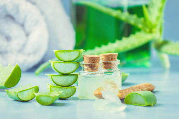 istock Aloe Vera extract in a small bottle and pieces on the table. Selective focus. 1045838372
