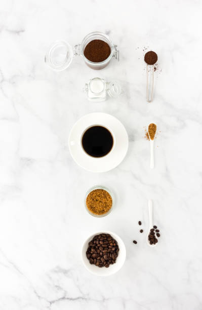 istock Black Coffee in Cup, Sugar, Ground Coffee and Beans 1045839104