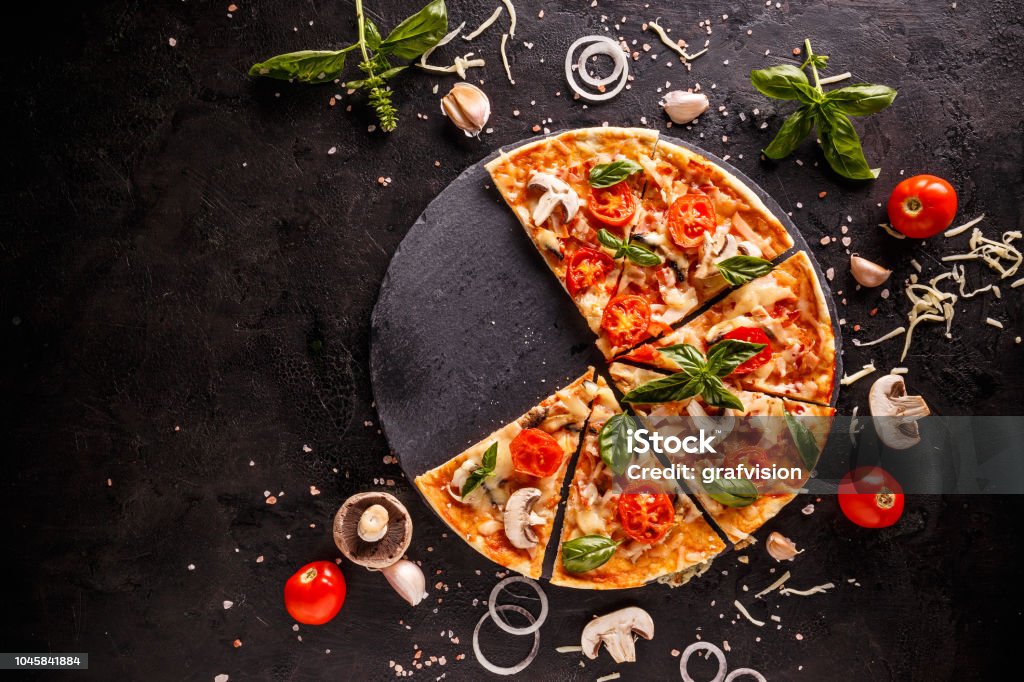 Fresh Italian pizza Fresh Italian pizza with mushrooms tomatoes and cheese, space for your text Pizza Stock Photo