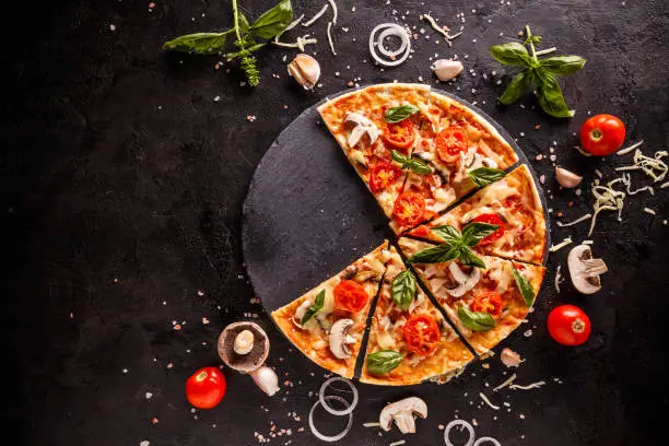 Fresh Italian pizza with mushrooms tomatoes and cheese, space for your text