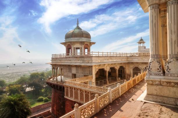 Historic Agra Fort with white marble dome architecture and carvings and portico structure. View of intricately carved Diwan-i-Khas and Musamman Burj dome of Agra Fort. stock photo