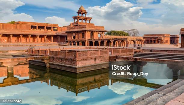 Fatehpur Sikri Anup Talao Is A Red Sandstone Architectural Structure With A Pool Connected With Four Bridges Used For Medieval Concerts Stock Photo - Download Image Now