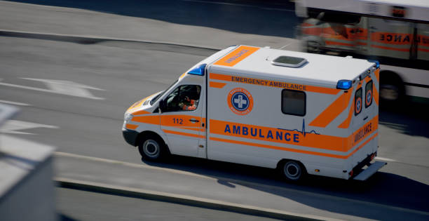 istock Ambulance driving on road in city 1045845406
