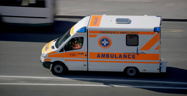 istock Ambulance driving on road in city 1045845436