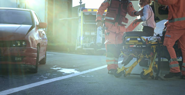 istock Paramedics holding car victim on stretcher 1045845494