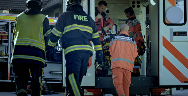 istock Paramedics loading injured person into ambulance 1045845498