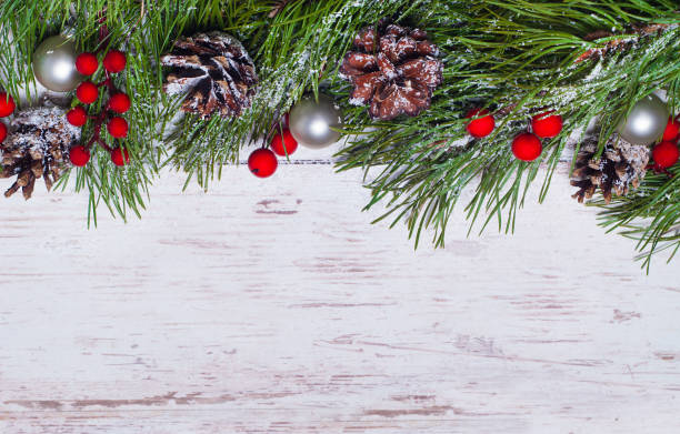istock Christmas wooden background with pine tree, top view 1045845598