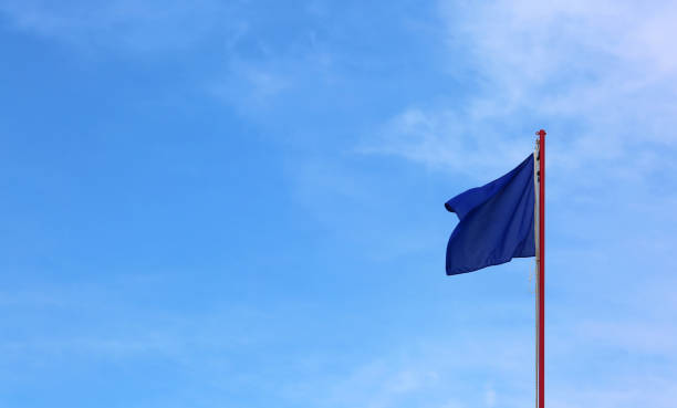 istock blue flag waves on the blue sky 1045845934