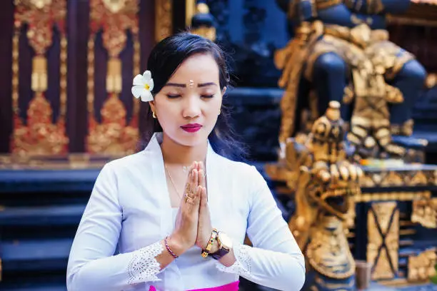 Photo of Balinese woman praying