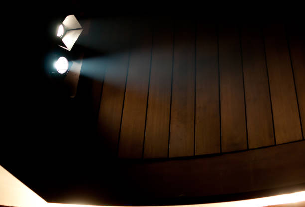 istock stage light in the theater with wooden background 1045852452
