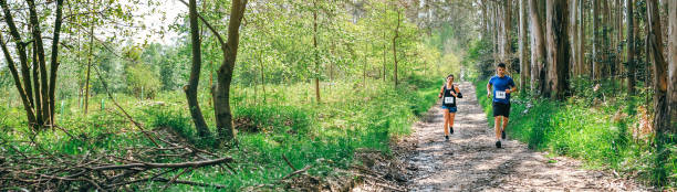 istock Young woman and man doing trail 1045853826